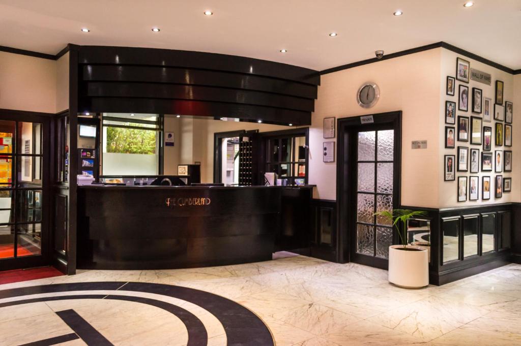a lobby of a hotel with a reception desk at Cumberland Hotel - OCEANA COLLECTION in Bournemouth