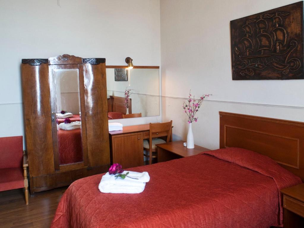 Postel nebo postele na pokoji v ubytování Hotel Acropolis