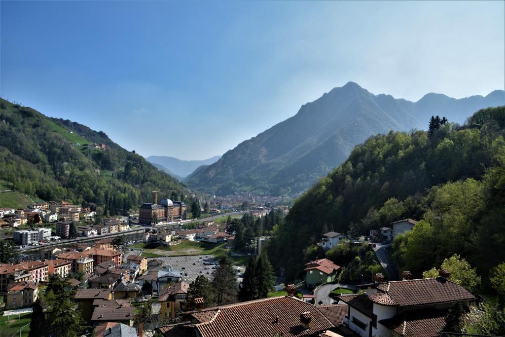 a town in a valley with mountains in the background at Ca' del Michelàs in San Pellegrino Terme