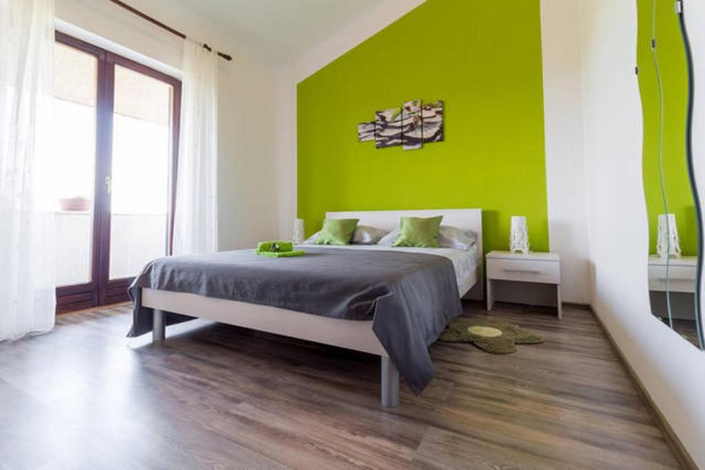 Postel nebo postele na pokoji v ubytování Green Oasis
