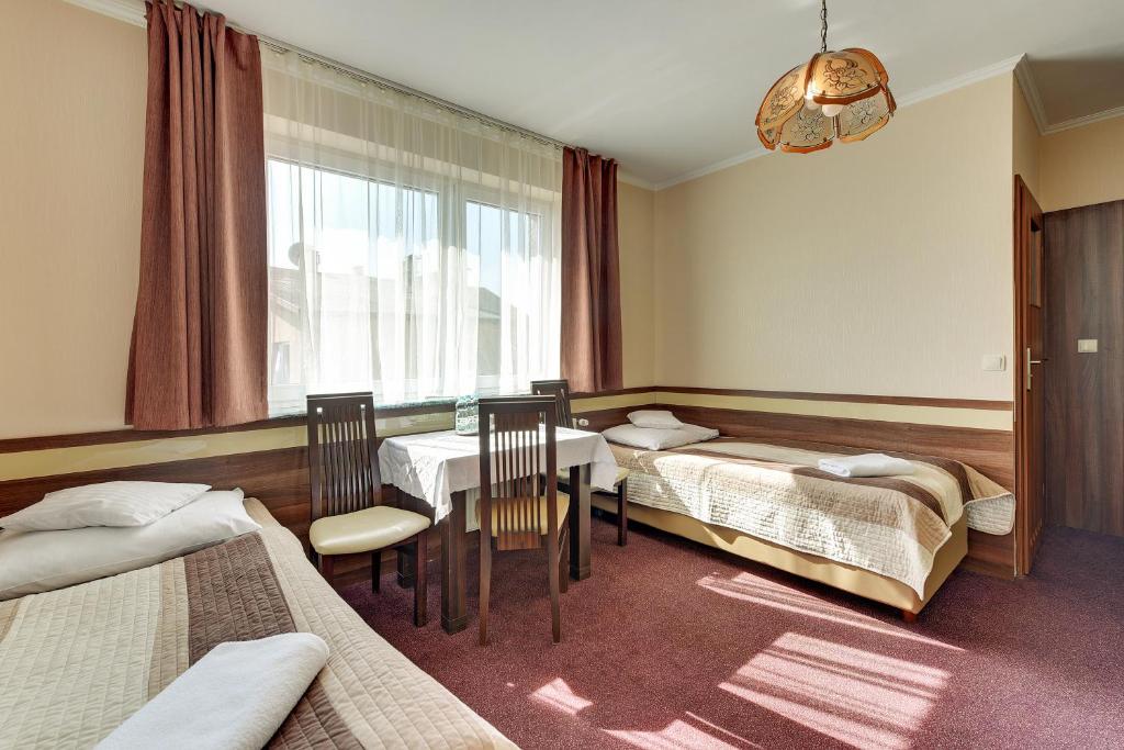 Postel nebo postele na pokoji v ubytování Abak