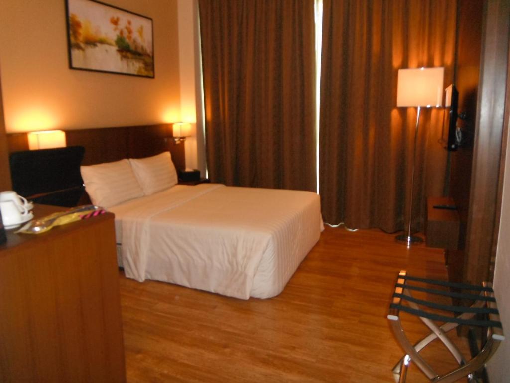 Postel nebo postele na pokoji v ubytování Keoja Hotel