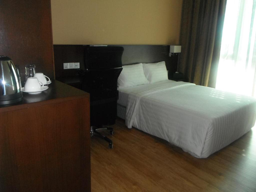 Postel nebo postele na pokoji v ubytování Keoja Hotel