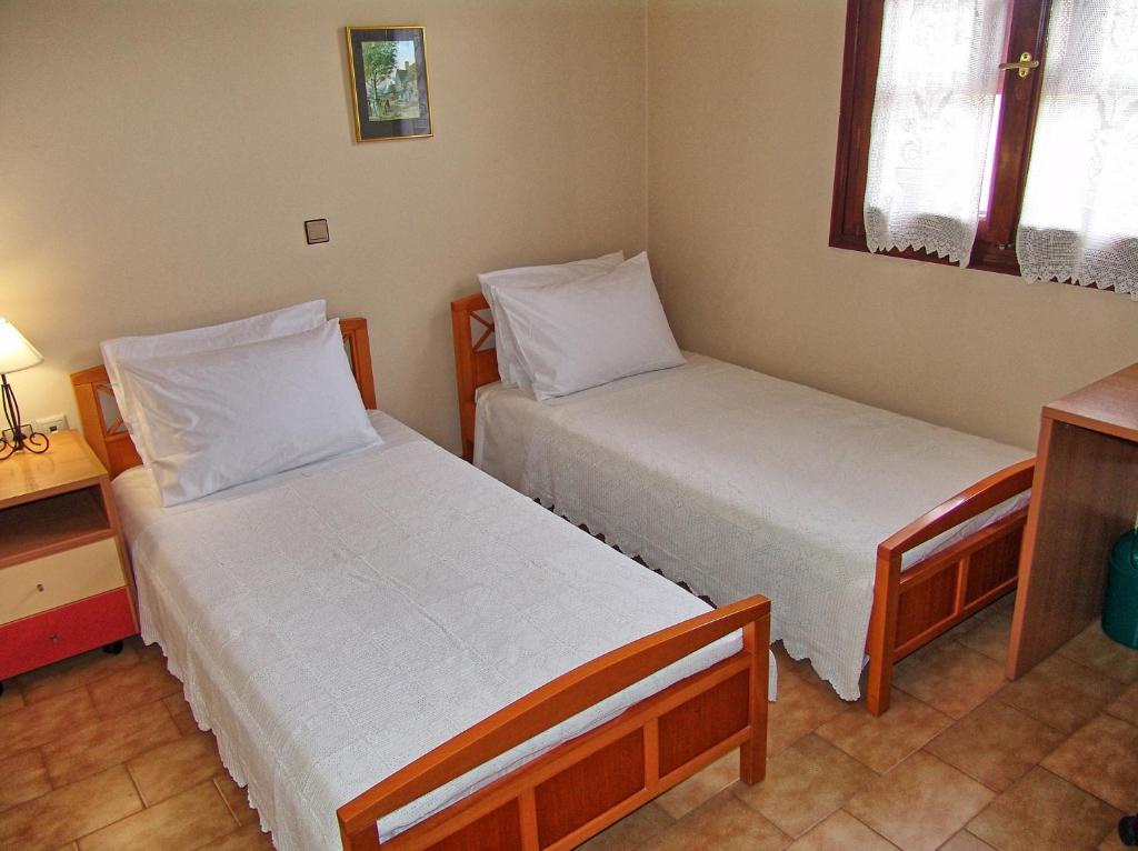 Postel nebo postele na pokoji v ubytování Casa Elaia