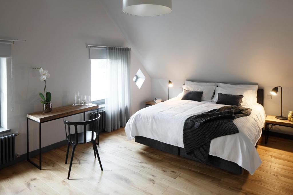 Postel nebo postele na pokoji v ubytování Zoltners Hotel