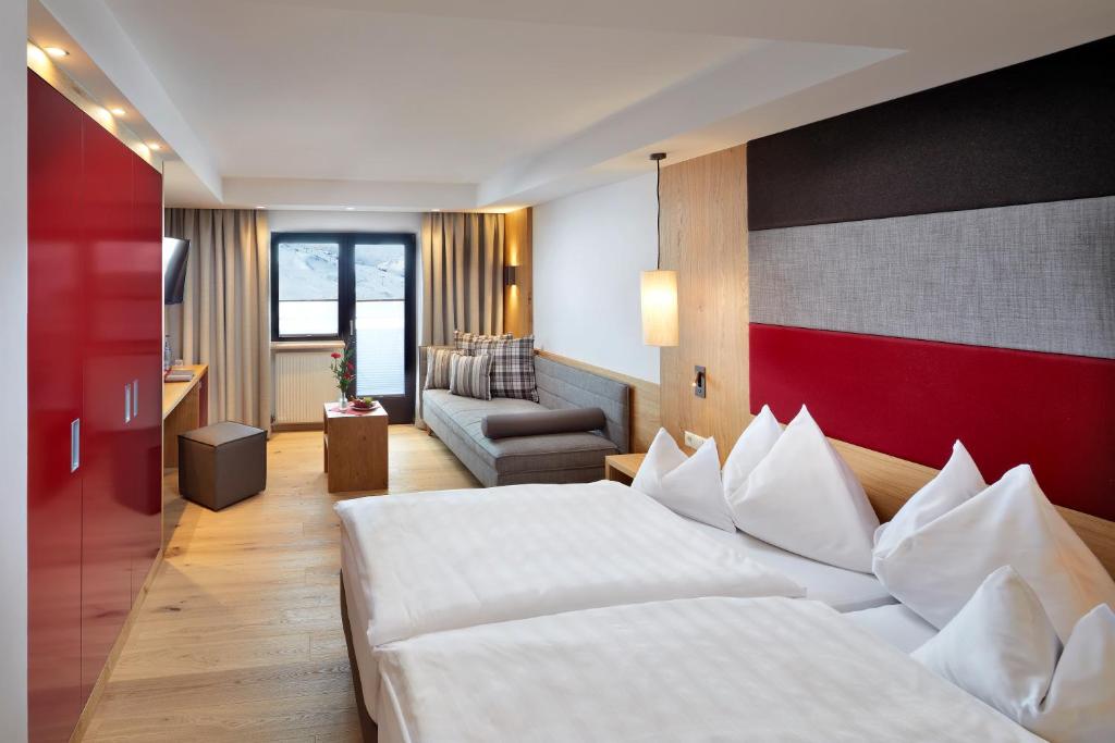 Postel nebo postele na pokoji v ubytování Hotel Konradin