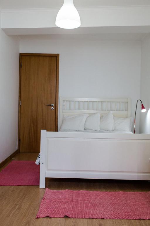 Postel nebo postele na pokoji v ubytování Casa de Hóspedes Porto Pim