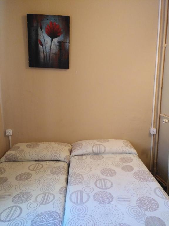 Postel nebo postele na pokoji v ubytování Hostal Porta De Núria