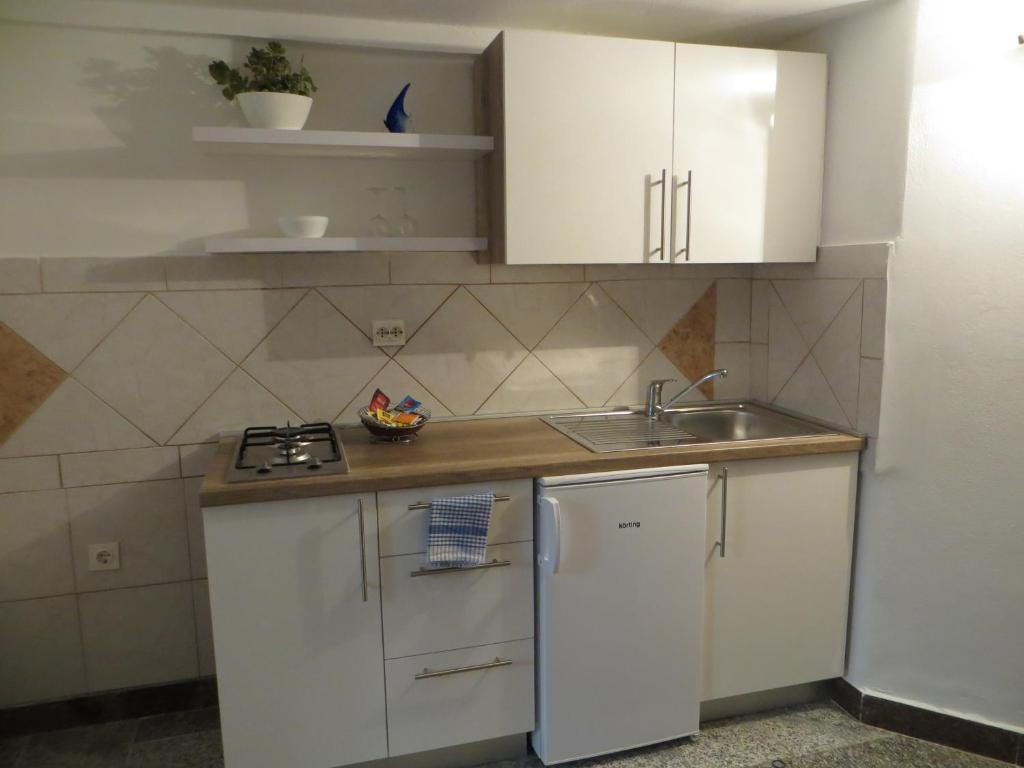 Kuchyň nebo kuchyňský kout v ubytování Rooms Mario