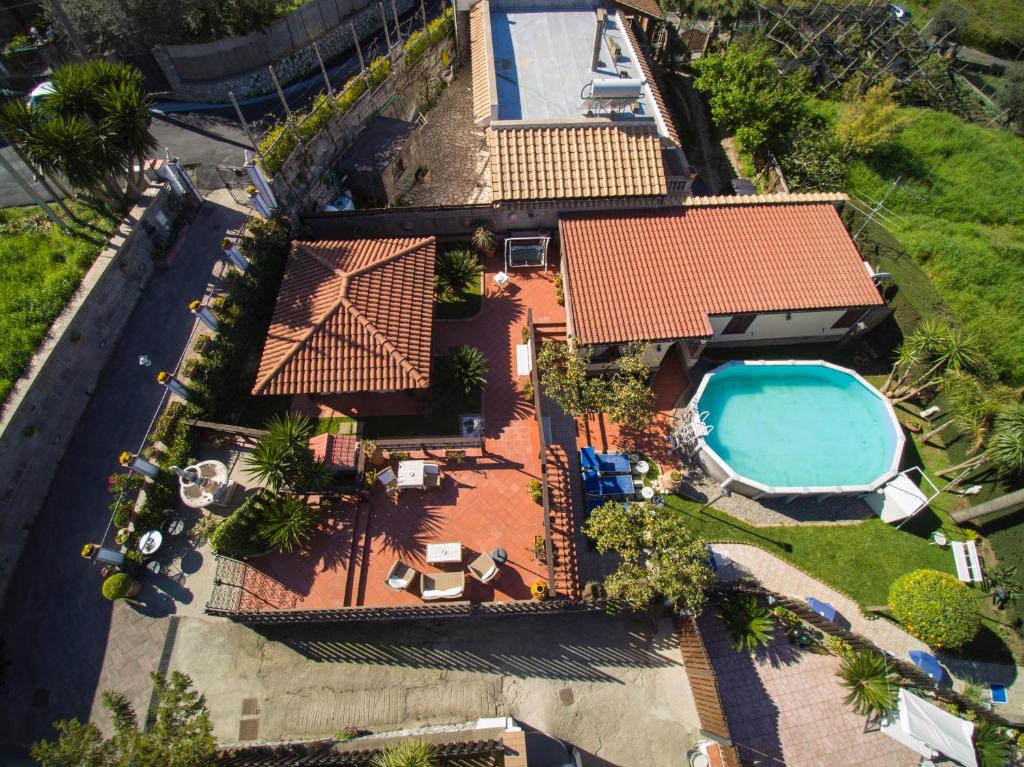 an overhead view of a house with a swimming pool at The Garden on Capri in Massa Lubrense