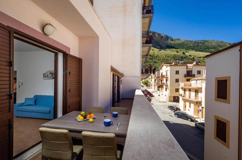 a view from the balcony of a house with a table and chairs at Il Glicine Appartamenti & Rooms in Castellammare del Golfo