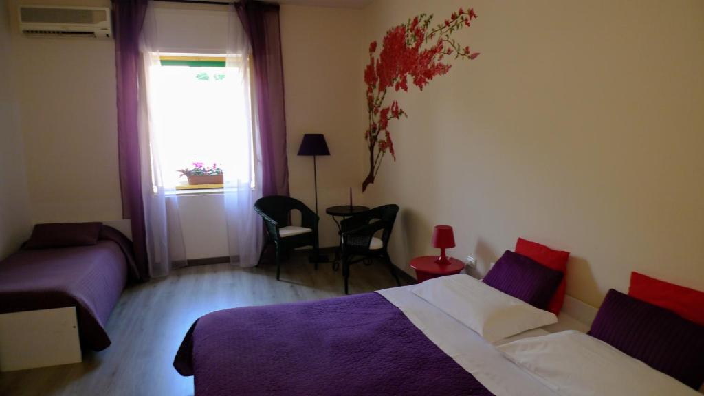 Postel nebo postele na pokoji v ubytování I Tetti di Siciliando