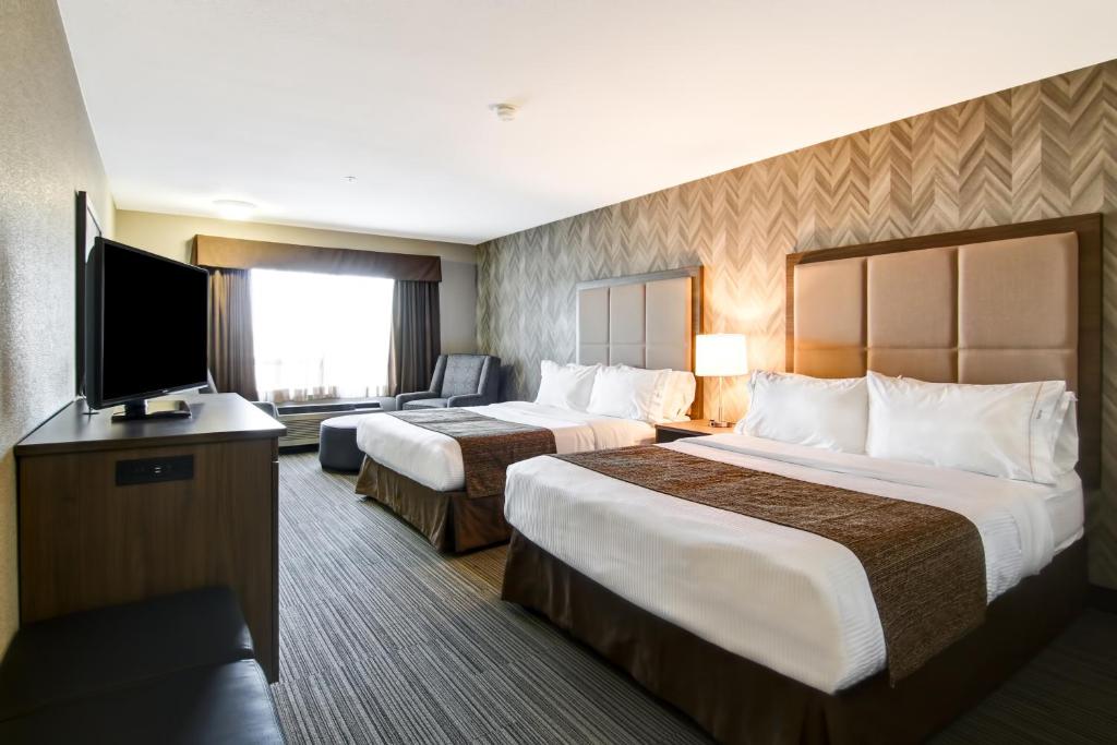 Een bed of bedden in een kamer bij Canalta Brooks