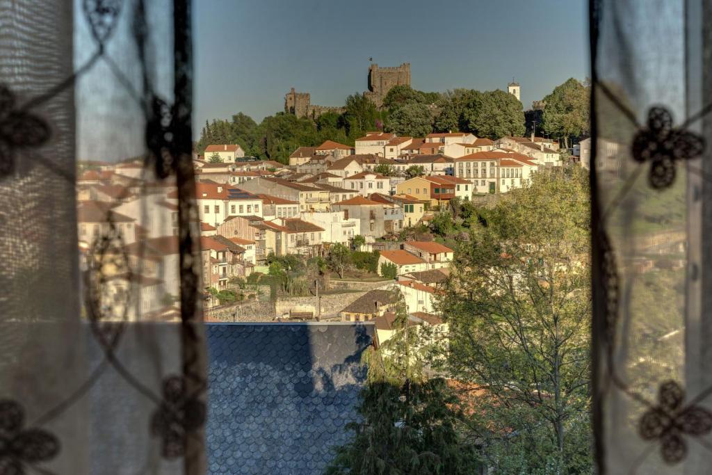 a view of a town from a window at Bragança Apartments in Bragança