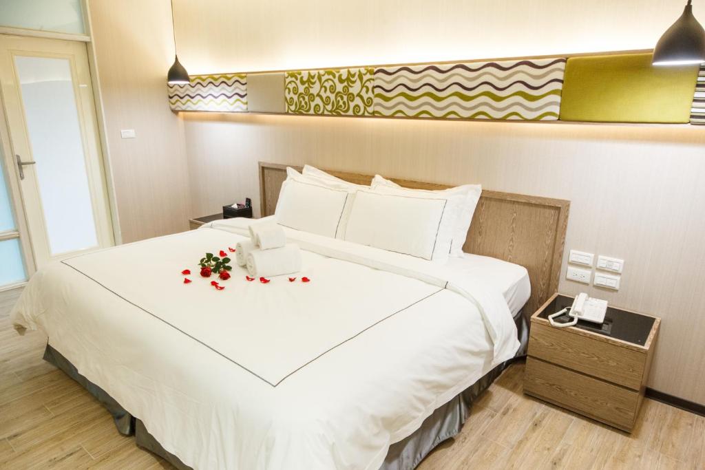 Postel nebo postele na pokoji v ubytování Da Pu Hotspring Hotel