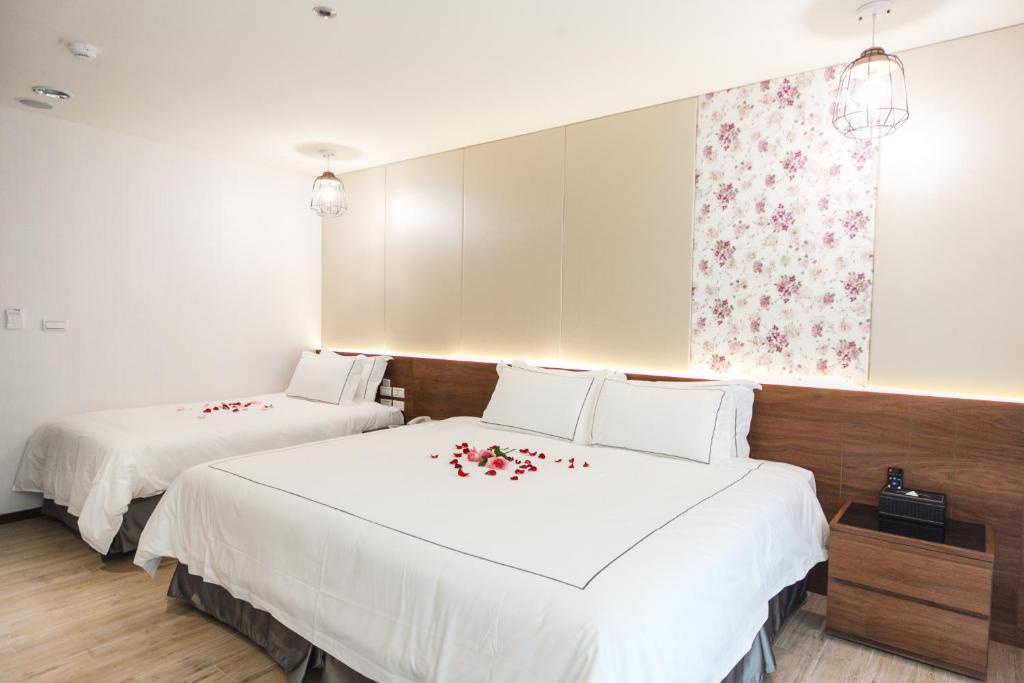Postel nebo postele na pokoji v ubytování Da Pu Hotspring Hotel