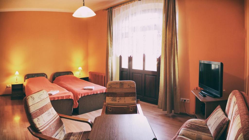 Posteľ alebo postele v izbe v ubytovaní Pensjonat Eldorado