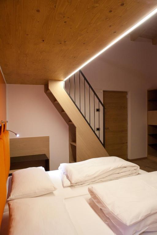 Voodi või voodid majutusasutuse Agritur I Colori toas
