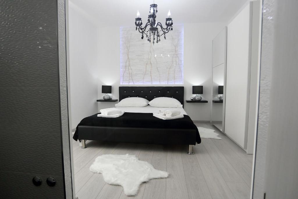 Postel nebo postele na pokoji v ubytování Apartments Taratta 1