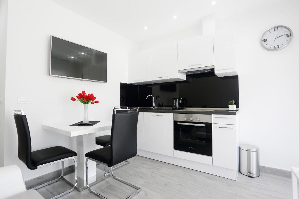 Kuchyň nebo kuchyňský kout v ubytování Apartments Taratta 1