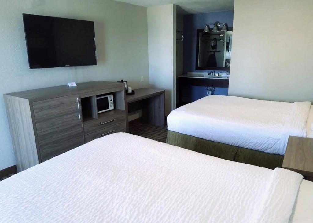 Postel nebo postele na pokoji v ubytování Seabreeze Inn - Fort Walton