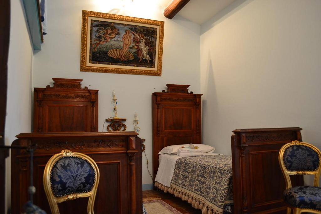 Postel nebo postele na pokoji v ubytování B&B Palazzo La Loggia