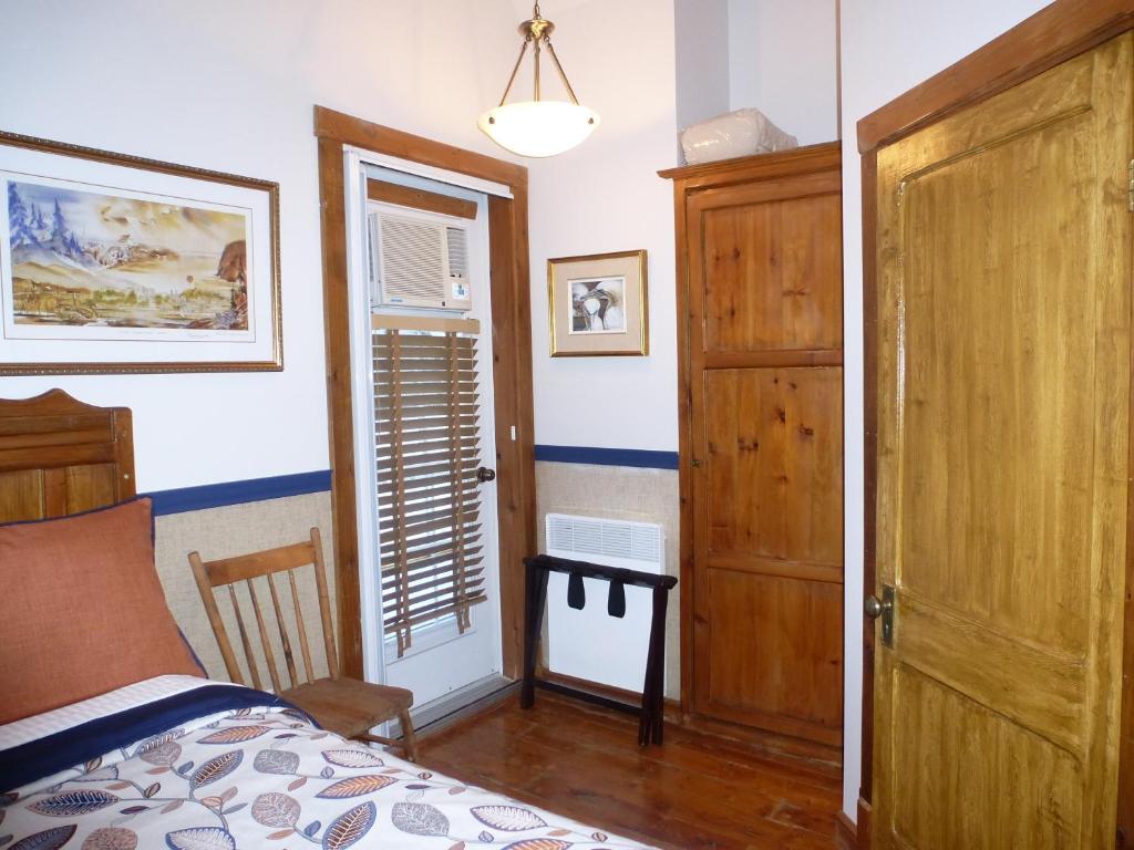 Rúm í herbergi á B&B Les Deux Pignons