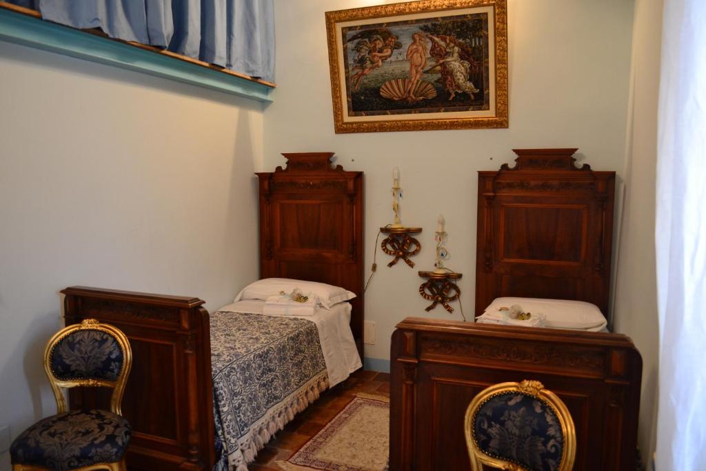 Postel nebo postele na pokoji v ubytování B&B Palazzo La Loggia