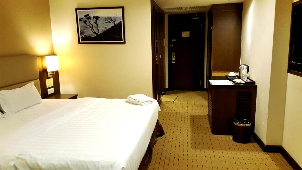 Postel nebo postele na pokoji v ubytování Lintas View Hotel