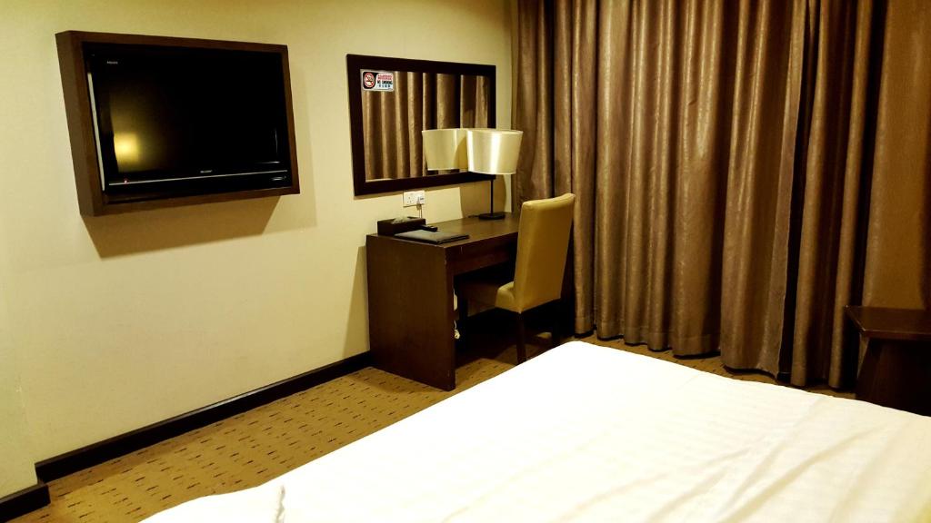 Postel nebo postele na pokoji v ubytování Lintas View Hotel