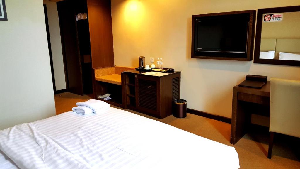 Postel nebo postele na pokoji v ubytování Lintas View Hotel