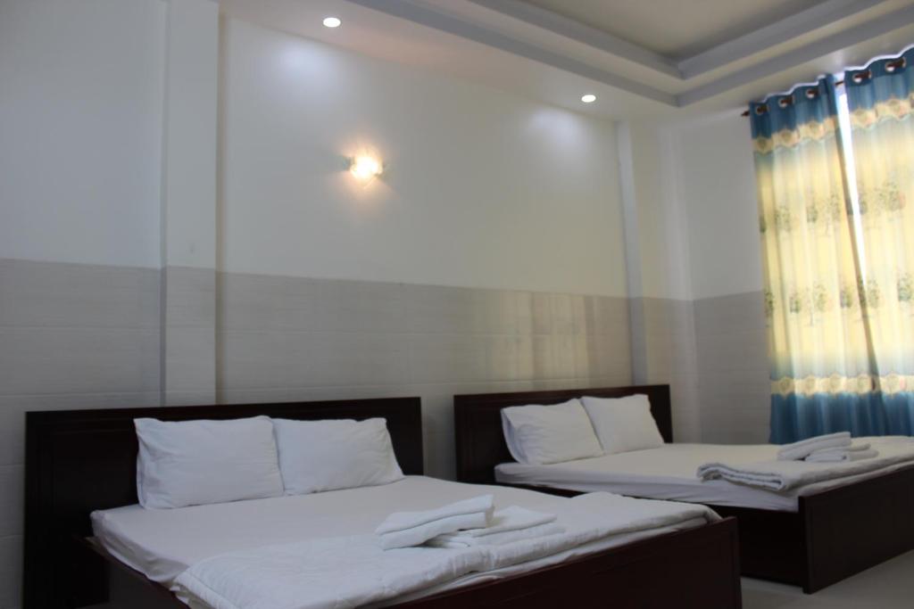 Postel nebo postele na pokoji v ubytování HaiVan HosTel