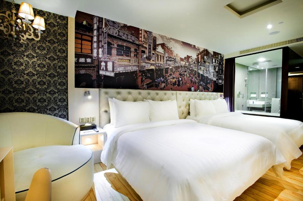 Postel nebo postele na pokoji v ubytování FX Hotel Tainan