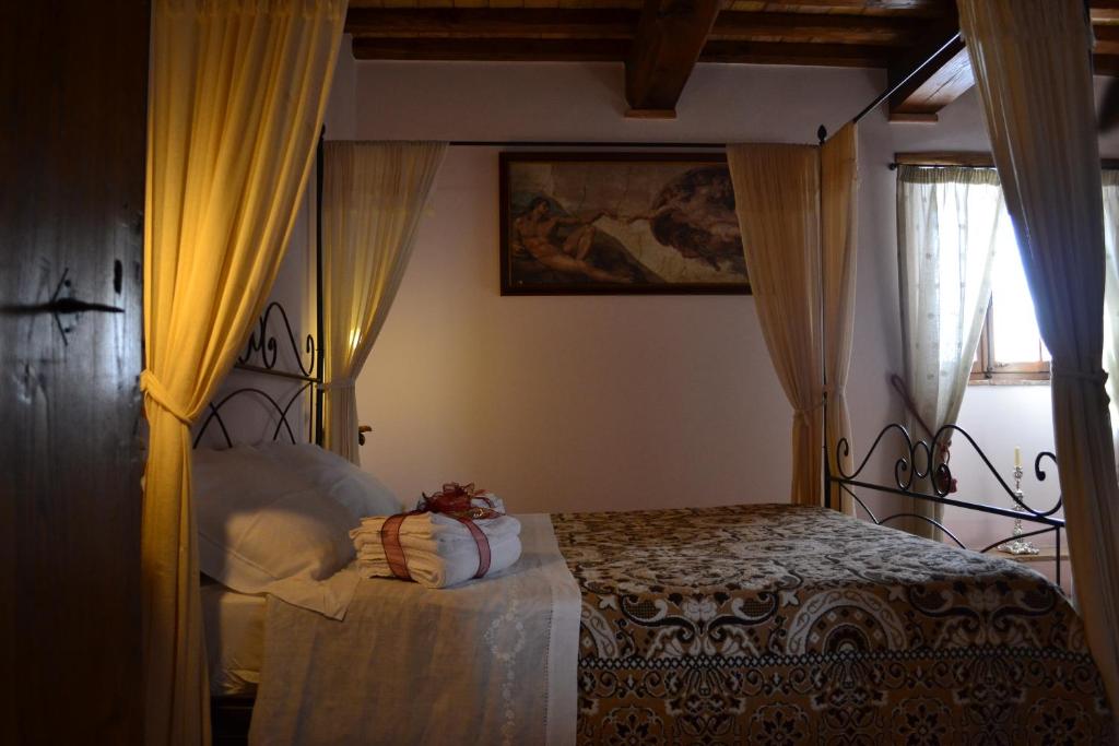 Postel nebo postele na pokoji v ubytování B&B Palazzo La Loggia