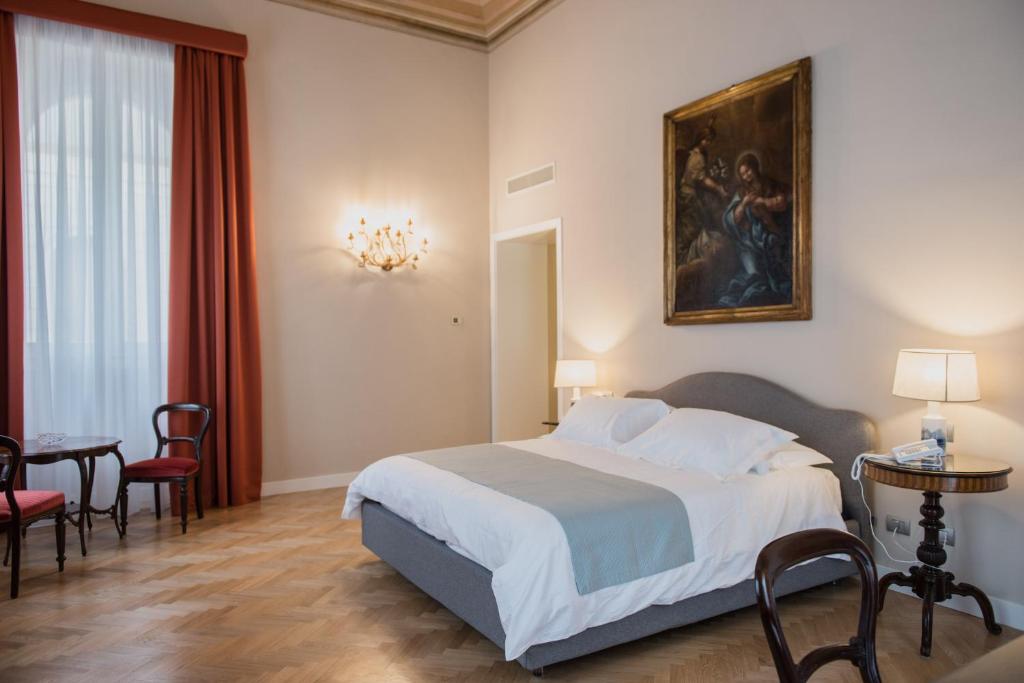 Postel nebo postele na pokoji v ubytování Villa Pulejo