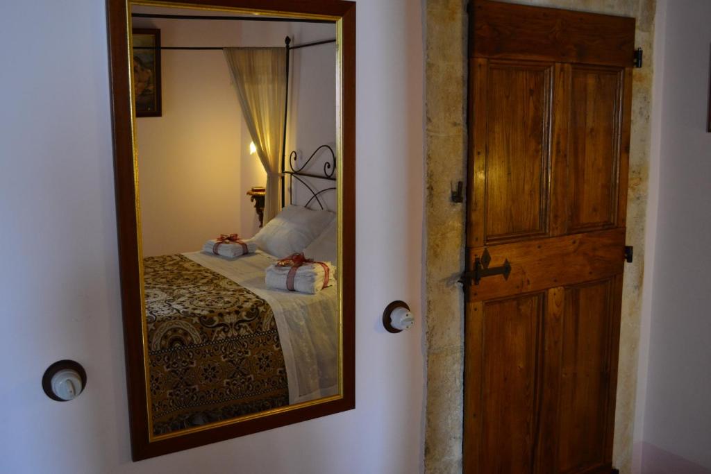 Postel nebo postele na pokoji v ubytování B&B Palazzo La Loggia