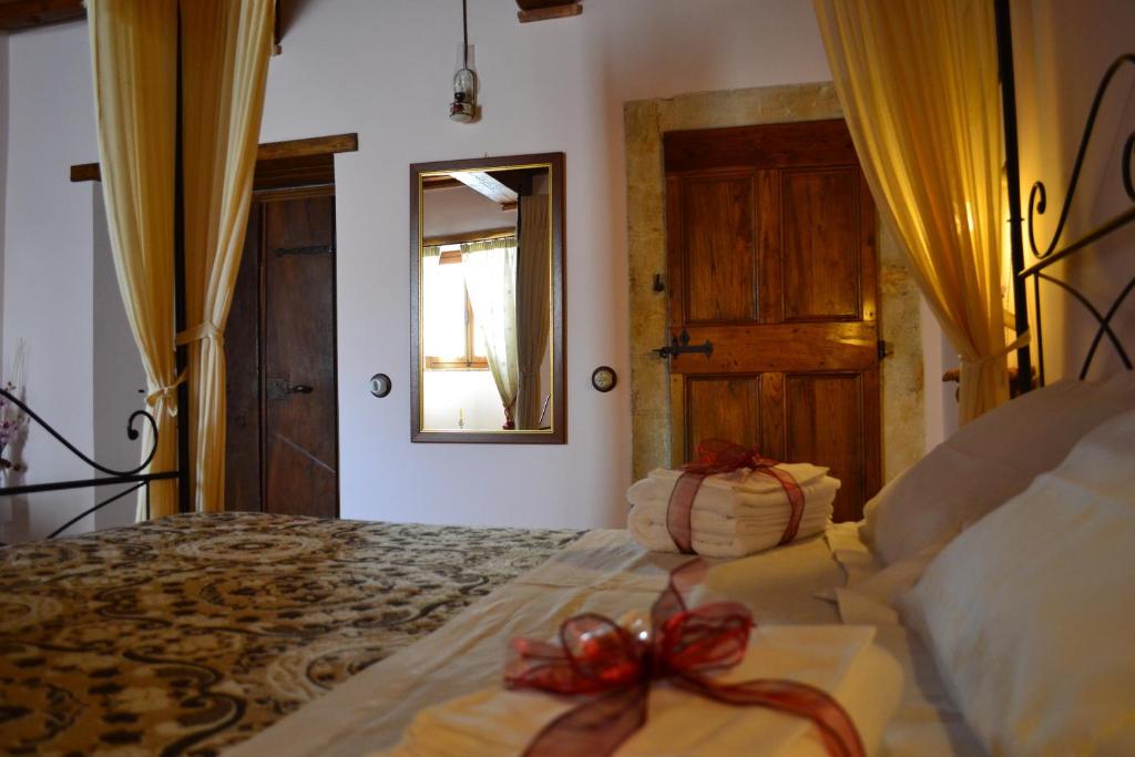 Postel nebo postele na pokoji v ubytování B&B Palazzo La Loggia