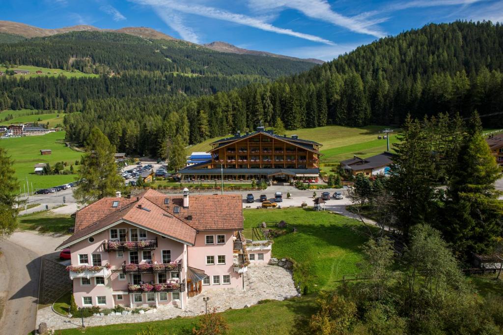 an aerial view of a large building in the mountains at BAD MOOS Dependance "Mühlenhof" in Sesto