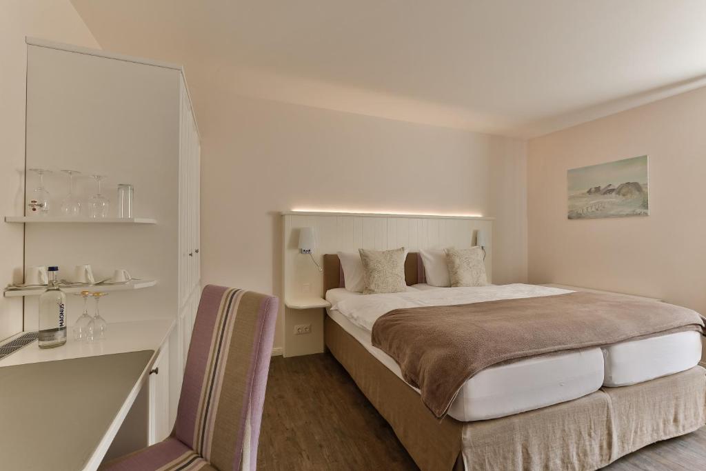 Postel nebo postele na pokoji v ubytování Hotel Uthland
