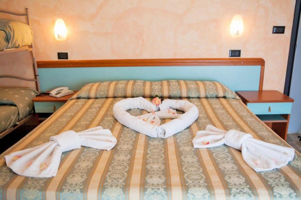 Postel nebo postele na pokoji v ubytování Hotel Vernel