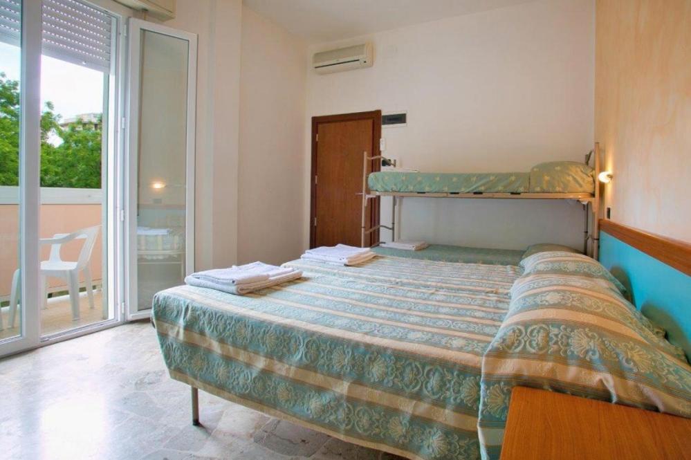 Postel nebo postele na pokoji v ubytování Hotel Vernel