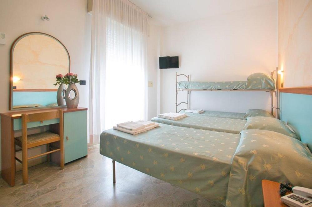 Postel nebo postele na pokoji v ubytování Hotel Vernel