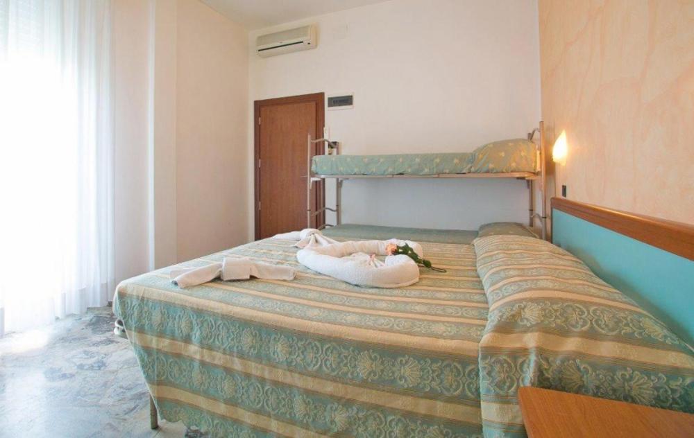 Postel nebo postele na pokoji v ubytování Hotel Vernel