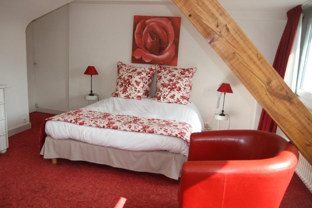 Postel nebo postele na pokoji v ubytování Hotel Le Suroit