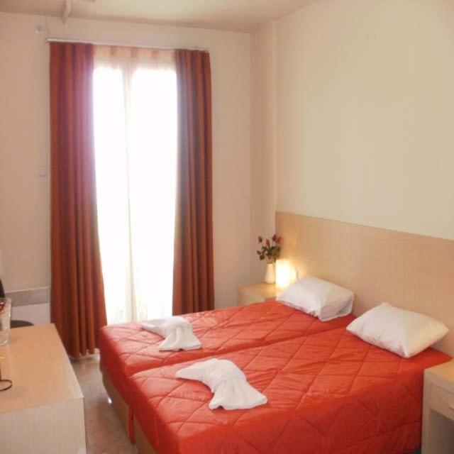 Postel nebo postele na pokoji v ubytování Amfitrion Hotel