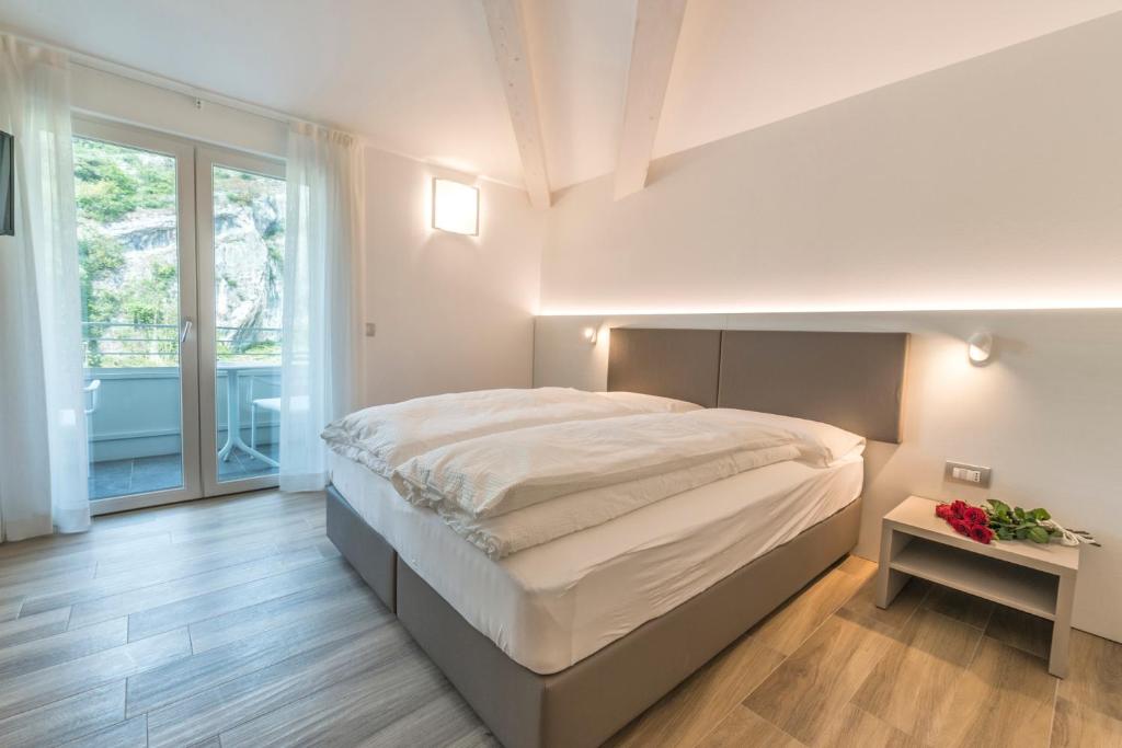Postel nebo postele na pokoji v ubytování Albergo Garni Francesco