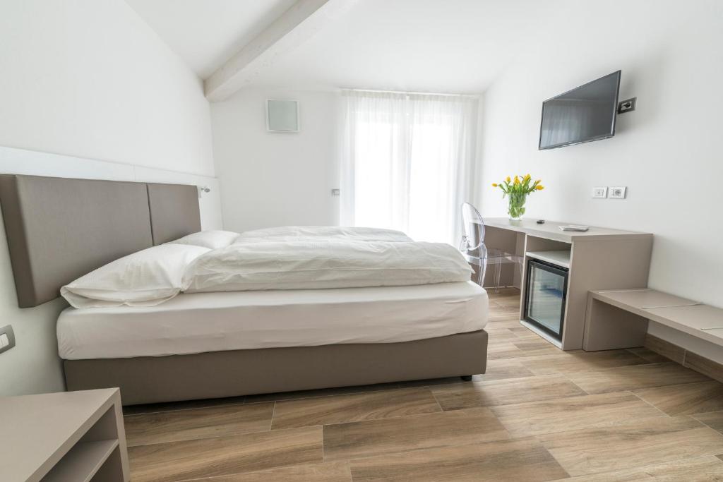 Postel nebo postele na pokoji v ubytování Albergo Garni Francesco