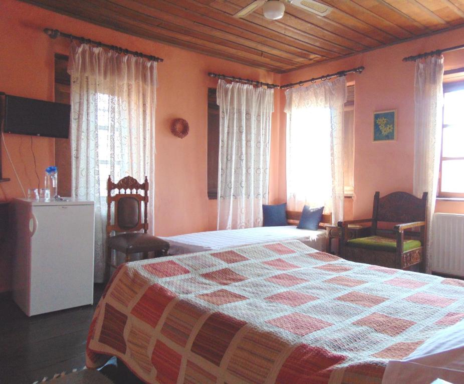 Postel nebo postele na pokoji v ubytování Archontiko Parisis