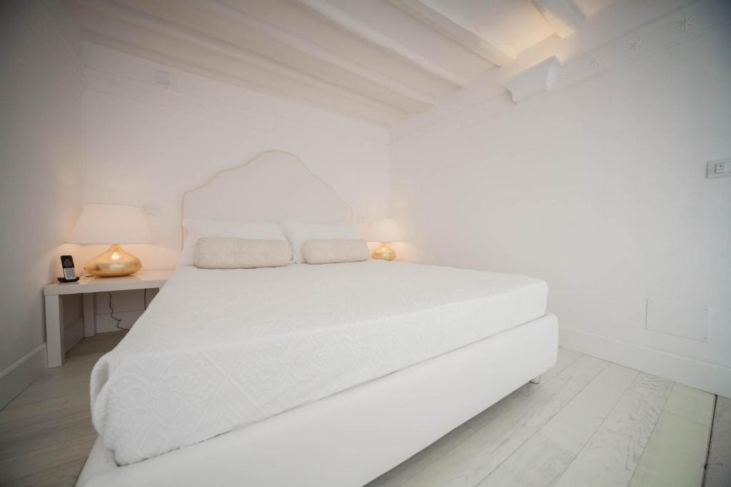 Cama o camas de una habitación en La Settima Luna Hotel