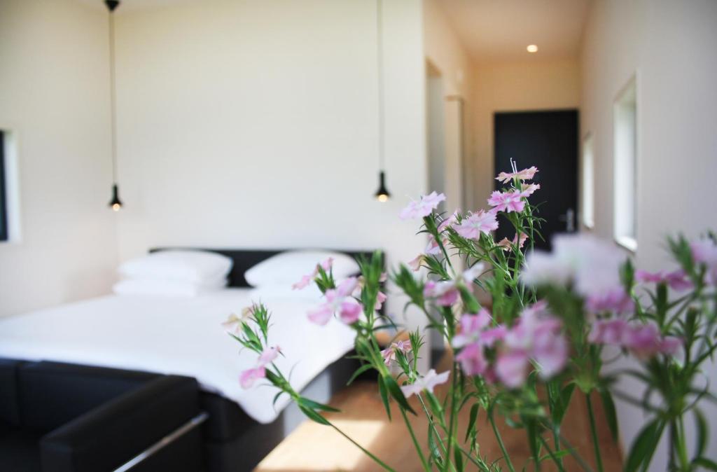 Postel nebo postele na pokoji v ubytování Hotel & Restaurant Weidumerhout